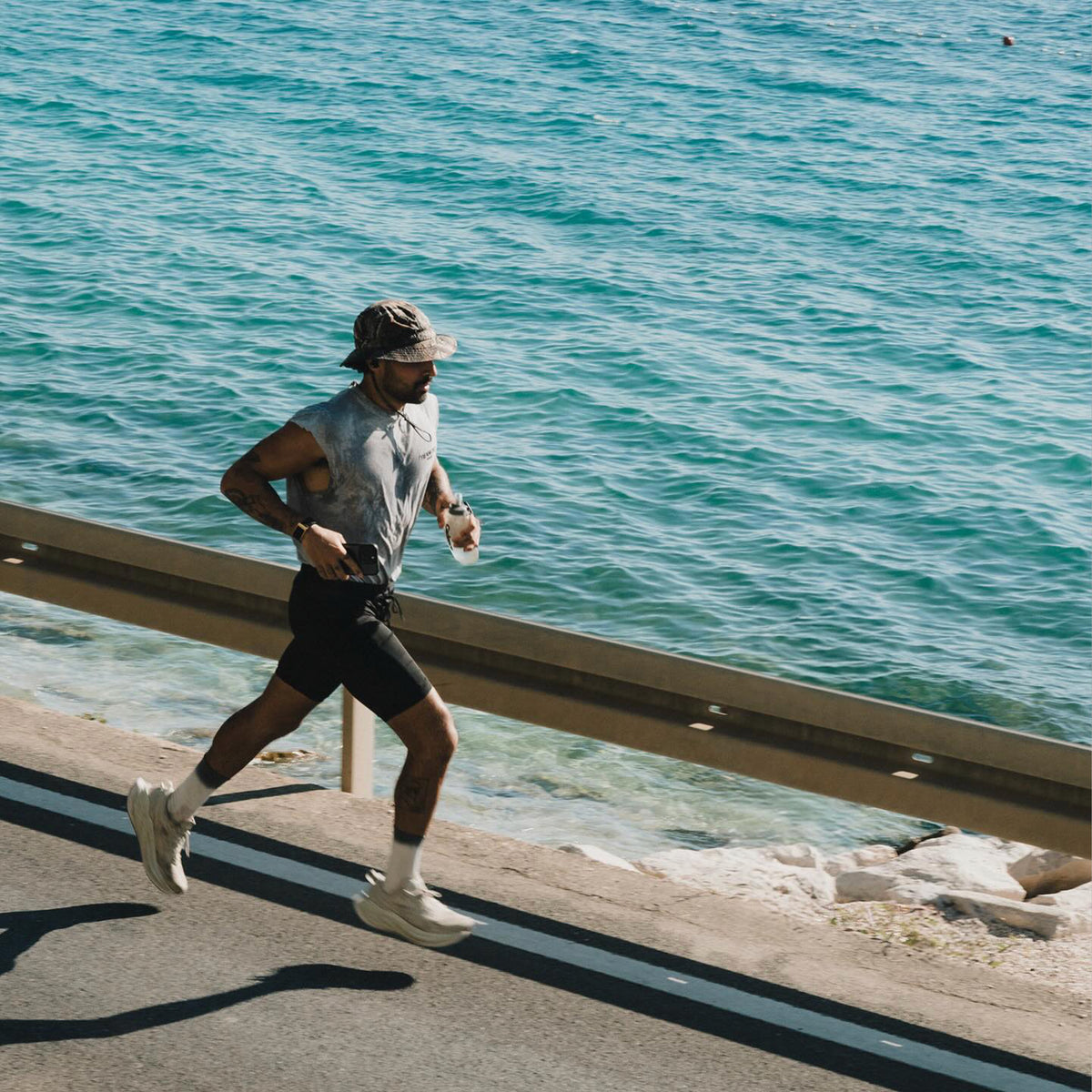 A runner on the seafront mid session