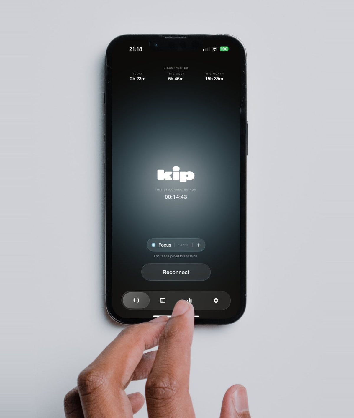 A hand taps the kip app on a phone, showing time disconnected